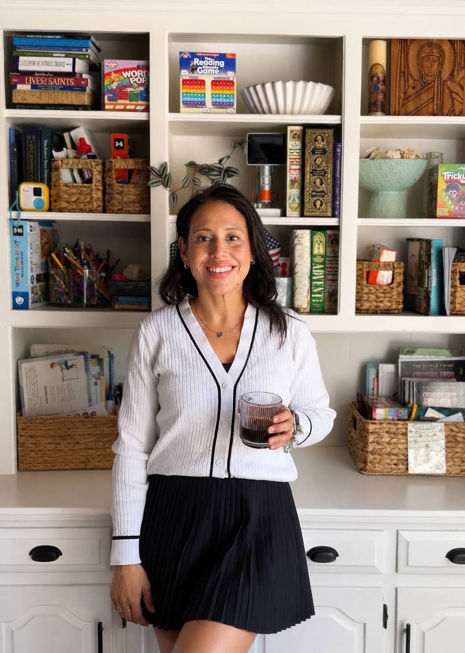 Daniela Cerrato standing in front of family bookshelves